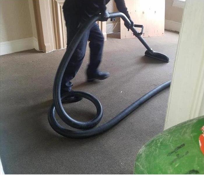 One of our technicians cleaning the common hallway carpeting. 